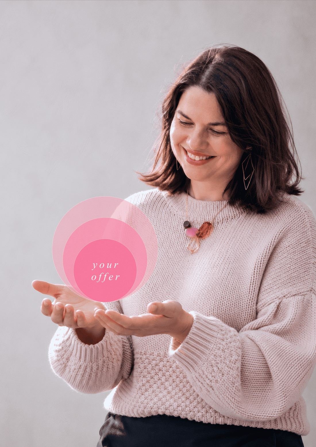 Cheryl Oliver holding glowing pink circles labelled 'your offer'