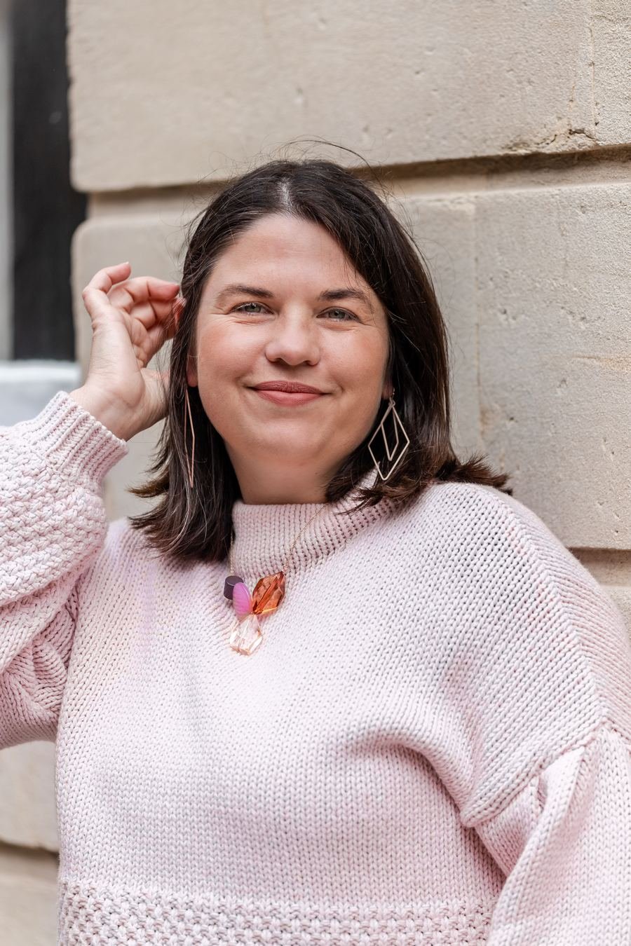 Cheryl Oliver in a pink jumper, smiling